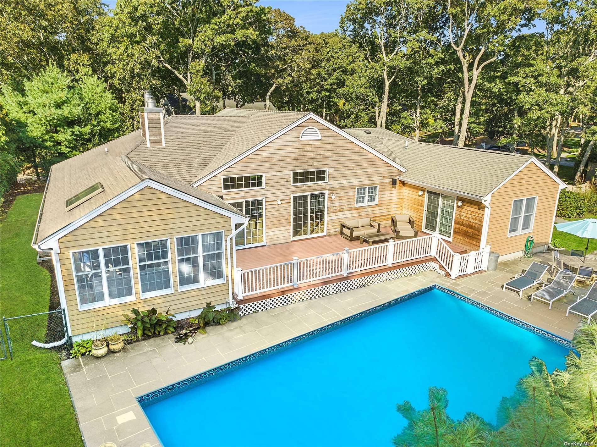 Nestled in a serene enclave in Westhampton Beach Village, this delightful one level home offers the perfect blend of comfort, style, and natural beauty.