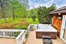 Wooden deck with a hot tub