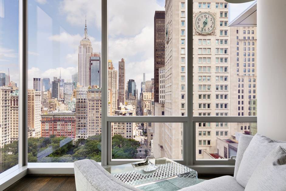 Soaring above Madison Square Park with iconic New York City views, this three bedroom, three and a half bath, full floor residence with a wrap terrace, offers stunning 360 degree ...