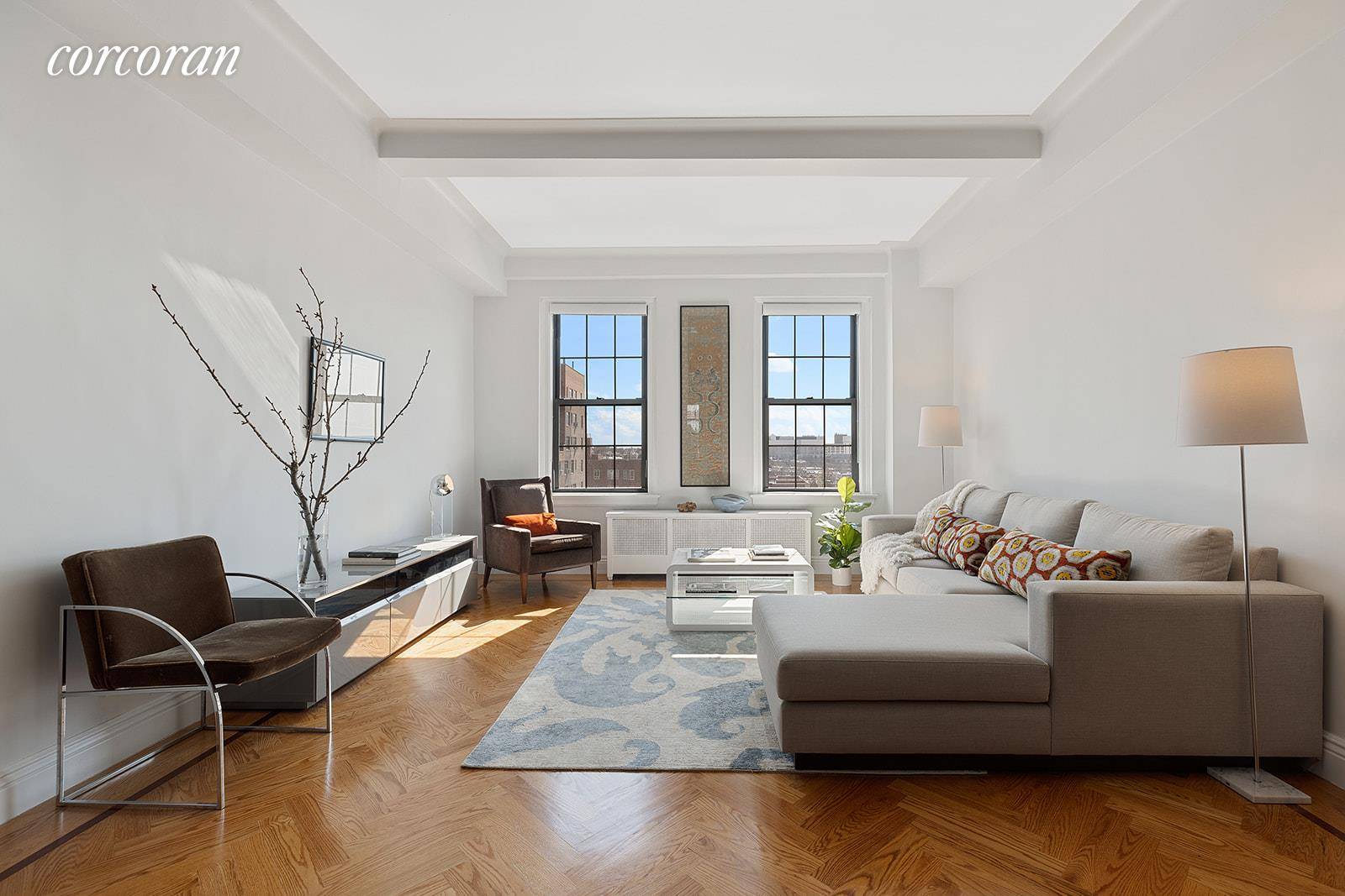 90 8th Avenue, Apt 9D With skyline views over three exposures, this expansive and recently renovated home has generous prewar proportions, classic details, and exceptional light.