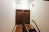 Doorway to outside featuring tile patterned floors