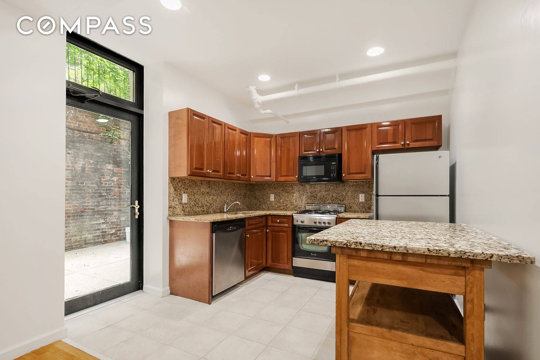 Sprawling true 3 bedroom 2 full baths garden level unit with enormous PRIVATE OUTDOOR PATIO on one of the best West Village blocks, West 10th St.