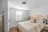 Bedroom featuring dark hardwood / wood-style floors