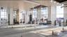 Exercise room with a wall of windows and a view of city