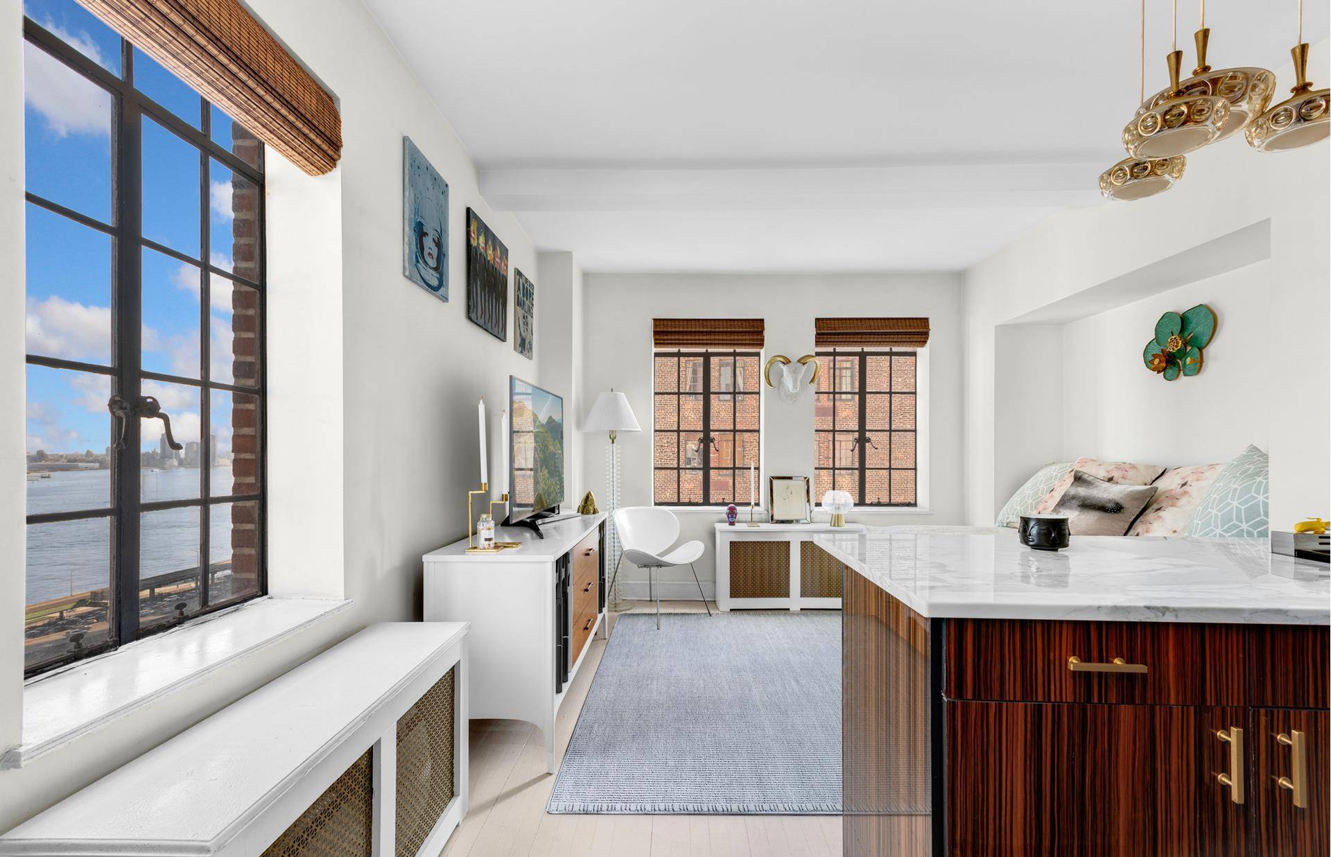 Indulge in luxury living with this stunning studio apartment, offering breathtaking views of the East River and United Nations.