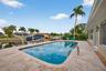 Beautiful resurfaced pool and travertine deck