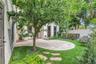 Backyard oasis- easy maintenance turf, Travertine pavers, covered porch and new white vinyl fence