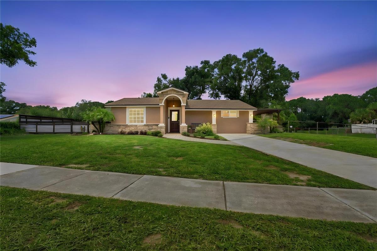 Front View warm color stone decor blends for a cohesive upgrade look, with Portico and Porch, paved walkway to complete the beautiful curb appeal.