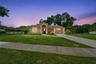 Front View warm color stone decor blends for a cohesive upgrade look, with Portico and Porch, paved walkway to complete the beautiful curb appeal.