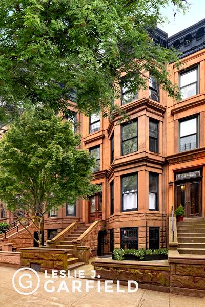 Set on Park Slope's renowned Garfield Place, Number 244 is a nearly 19' wide townhome originally built in the early 20th century.