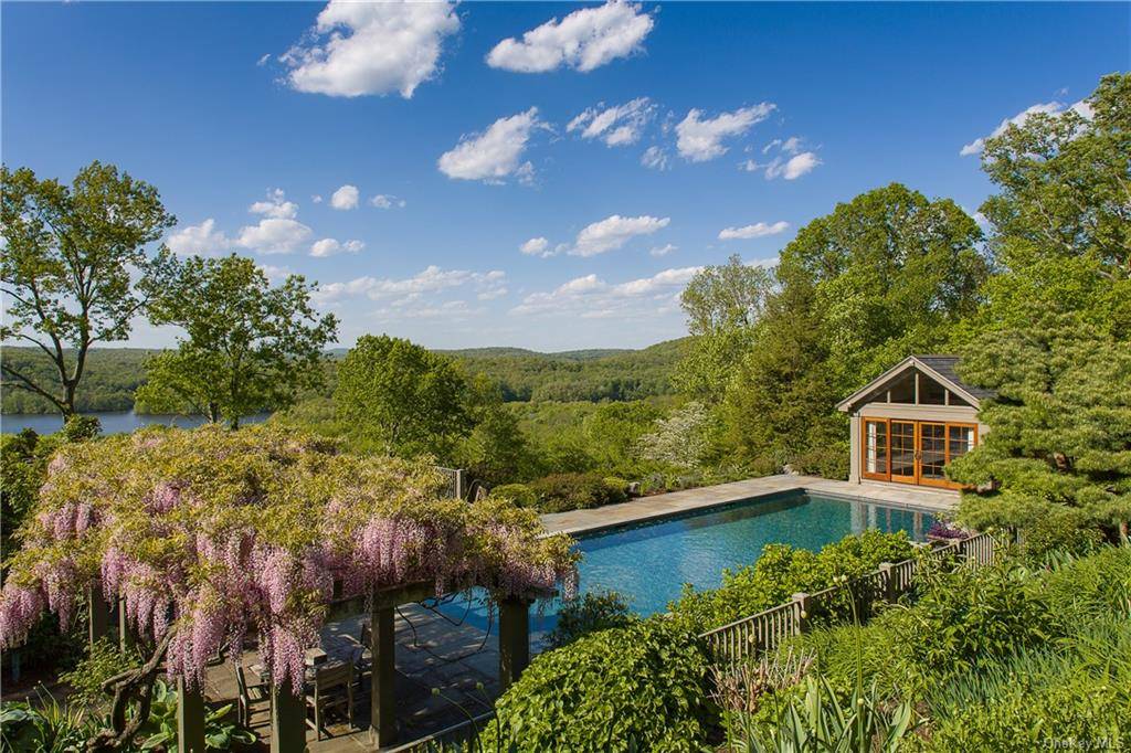 This incomparable turnkey estate is set atop one of Bedford's highest points with breathtaking panoramic views of the Croton Reservoir and the Lower Hudson Valley.