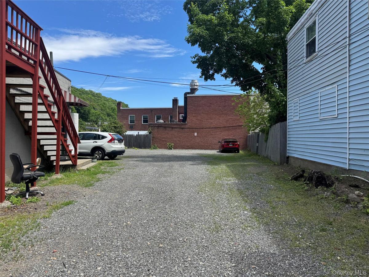 A standout feature is the private rear parking lot accommodating approximately 14 vehicles—an increasingly valuable asset in downtown Chappaqua. In ad