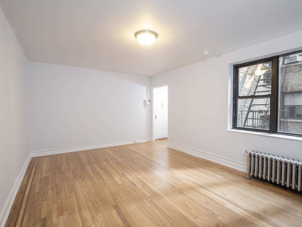 Large studio with three exposures available in best prime Chelsea location in prewar elevator building.
