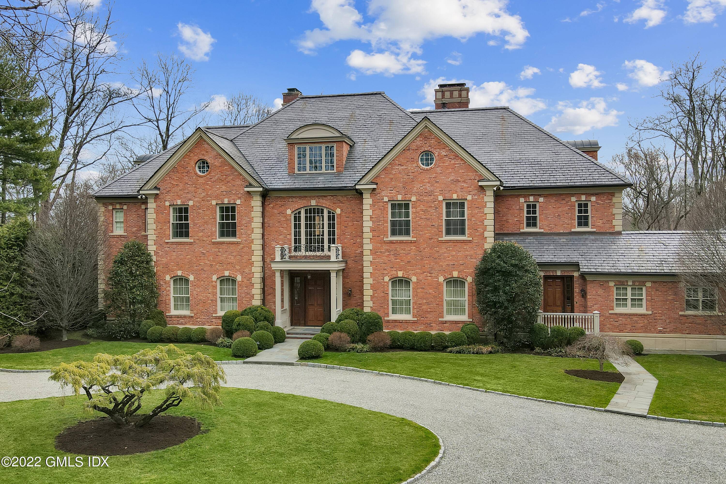 Custom built in 2010, this magnificent 7 bedroom stone manor is sited on over 2 flat acres, on one of the most coveted streets in Greenwich.