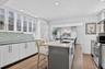 This open kitchen has a serene "flow" energy, it's without a doubt "the heart of the home". The island will be the most used spot in the house...