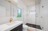 Guest ensuite bathroom (2nd bathroom) with custom cabinetry and fixtures
