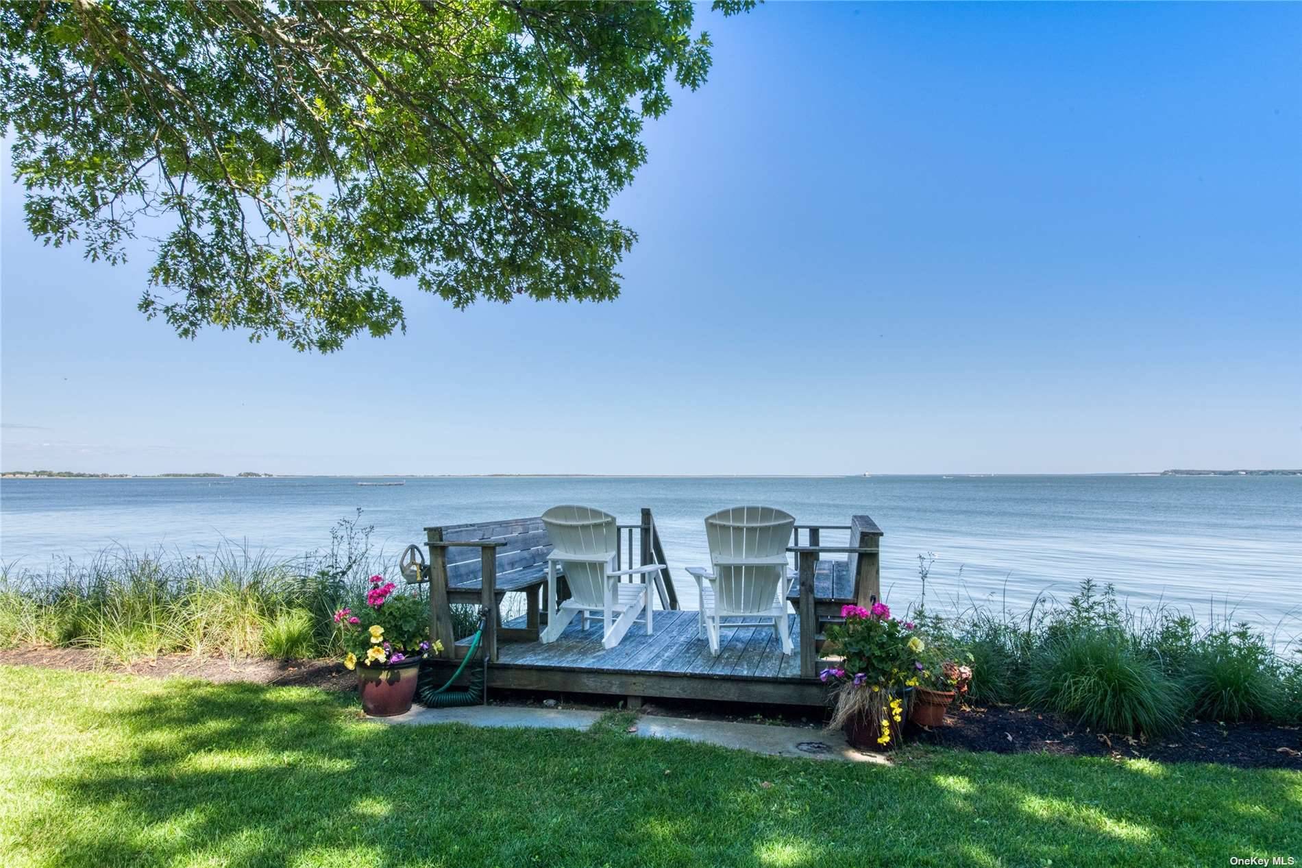 Relax and enjoy this beautifully appointed bay front house w private beach and stunning views of Orient Harbor, Bug Light and Shelter Island.