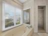 Primary Suite bath with soaking tub and walk in shower