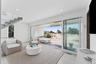 Living area with visible vents and recessed lighting