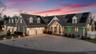 View of front of property featuring decorative driveway, a shingled roof, a garage, and roof mounted solar panels