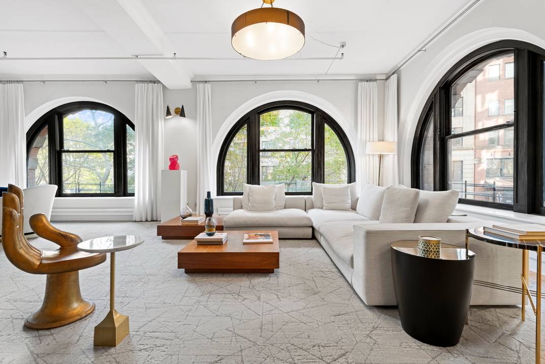 Welcome to this one of a kind duplex condo in the esteemed American Thread Building in TriBeca.