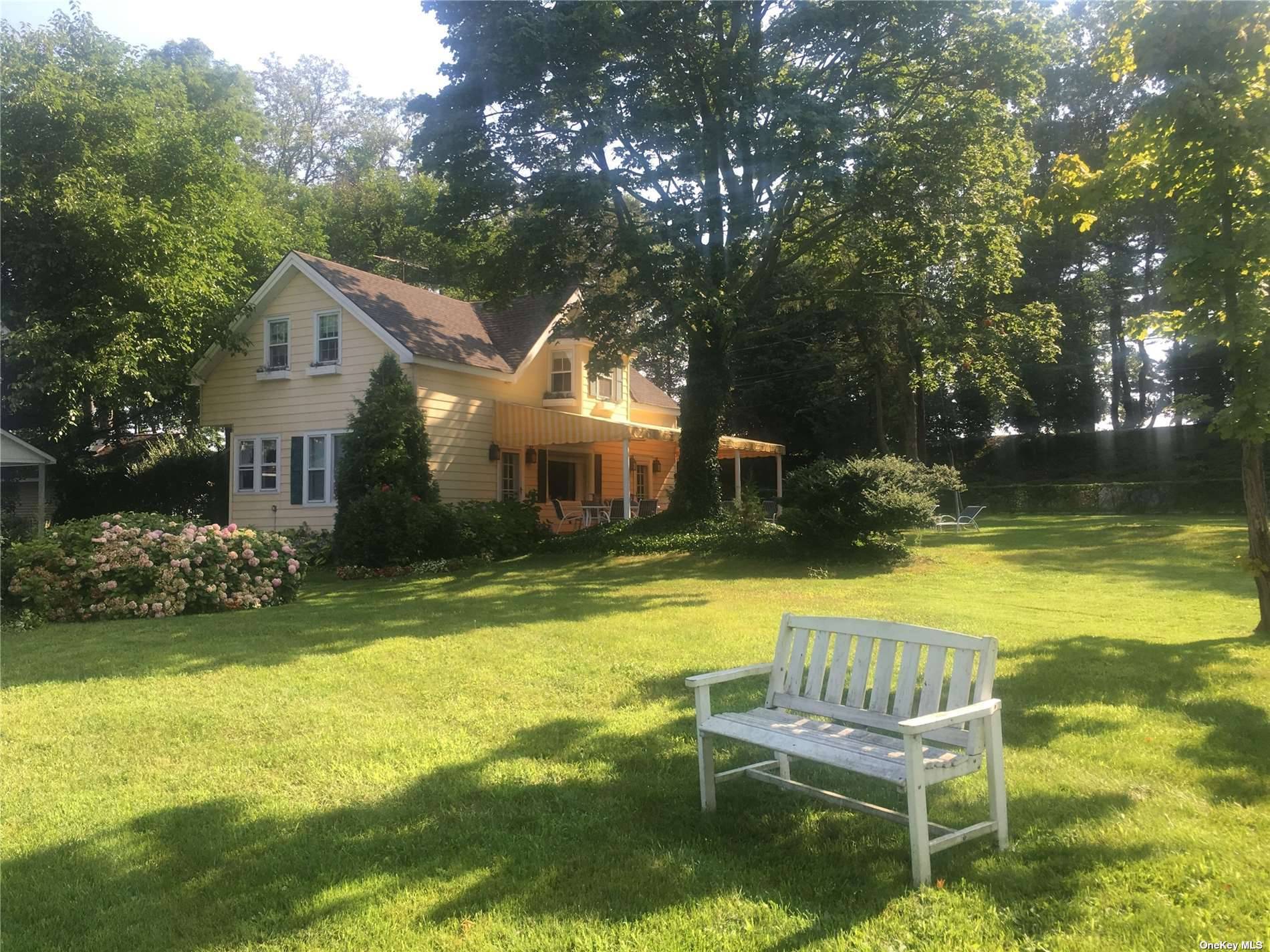 Impeccably maintained 2 Story Traditional house overlooking ocean estuary and surrounded by 100 acre wild bird sanctuary.