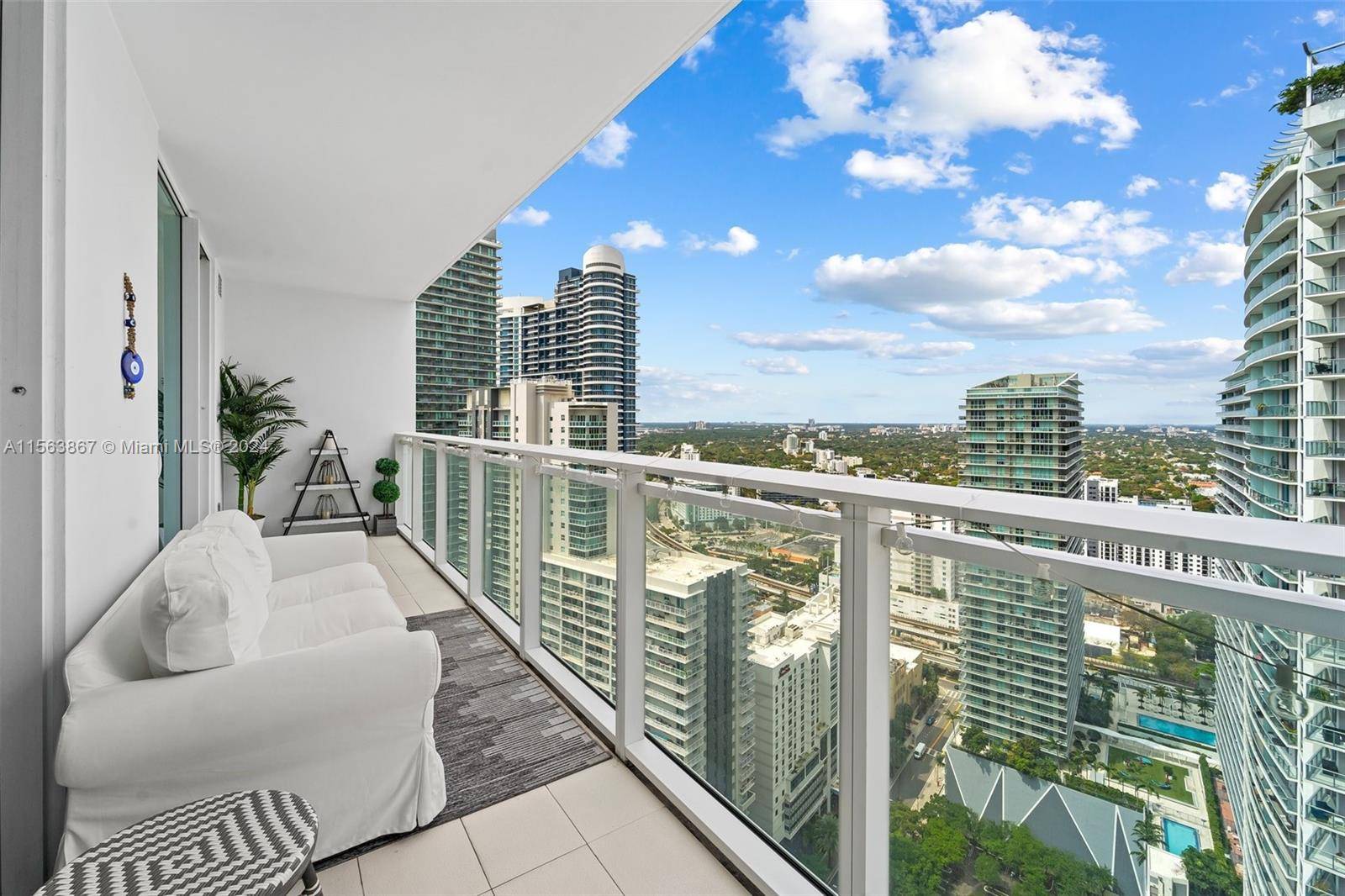 Experience the epitome of urban luxury living in this beautiful fully furnished, 2 Bedroom, 2 bathroom, plus Den corner unit at The Bond Brickell.