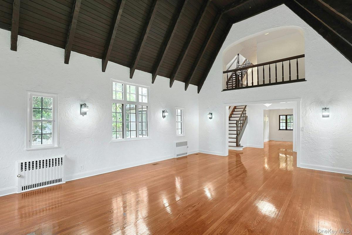 Bathed in natural light, this spectacular gathering space offers remarkable scale and architectural beauty rarely found in today's homes.