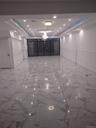 Spare room with a raised ceiling, light marble finish flooring, and recessed lighting
