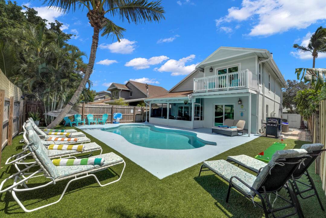 Beautiful 2 Story Key West style house with a gorgeous heated pool.