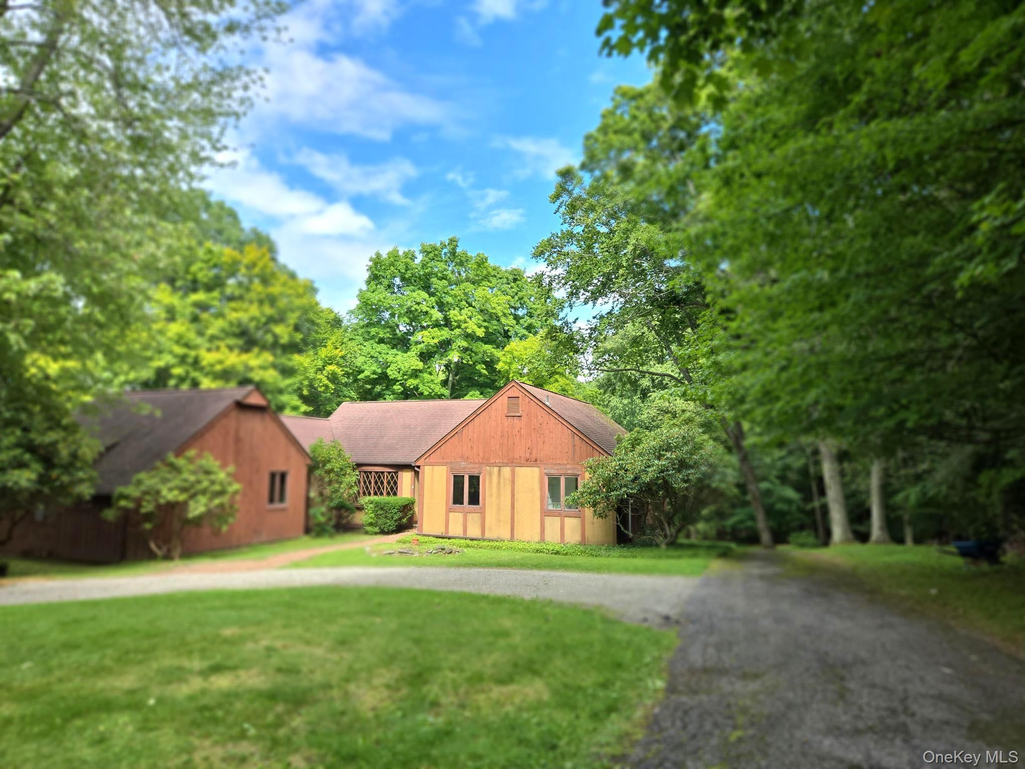 A circular driveway introduces this contemporary ranch