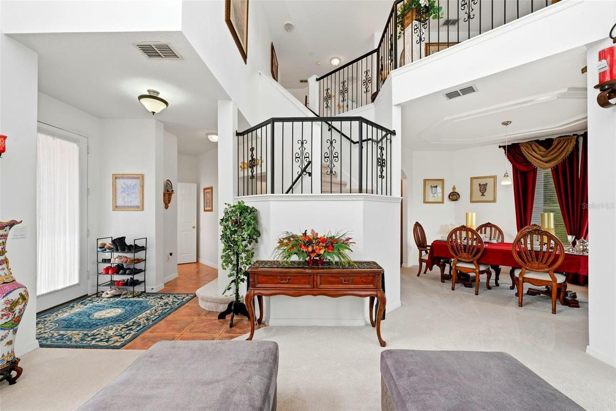 Winding staircase with wrought iron railing