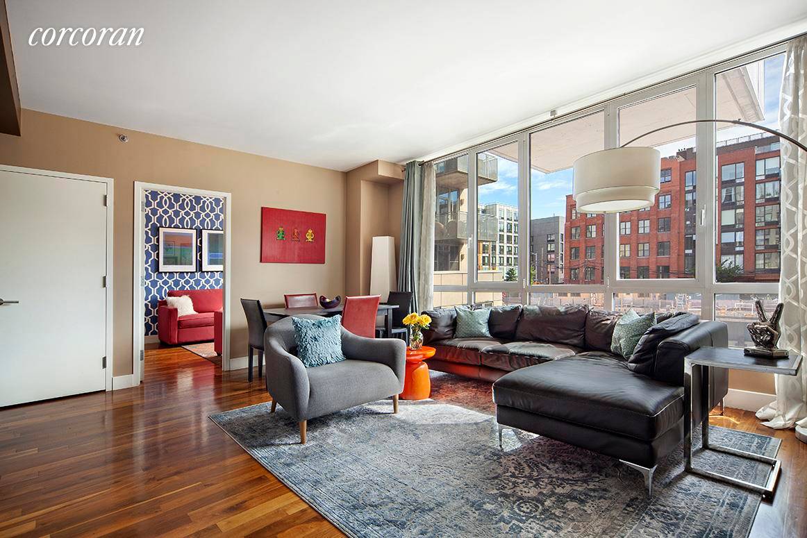 214 N 11th Street, residence 2V is a winged two bedroom, two bathroom home boasting an inviting open space with ample room for living, dining, and entertaining.
