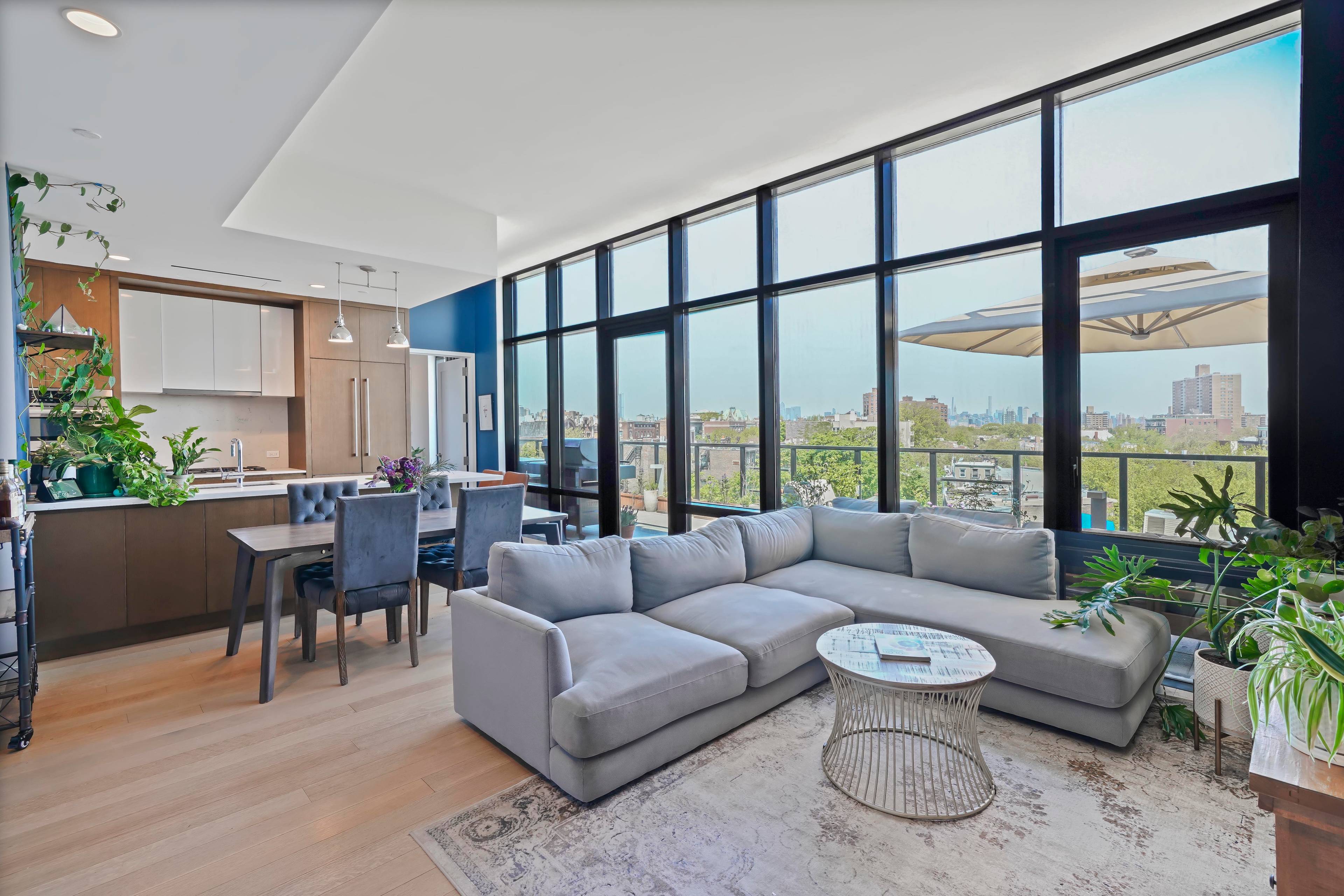 Penthouse PH3 at The Waverly Brooklyn is a stunning three bedroom residence with soaring ceilings, floor to ceiling windows, a private terrace, and sweeping skyline views.