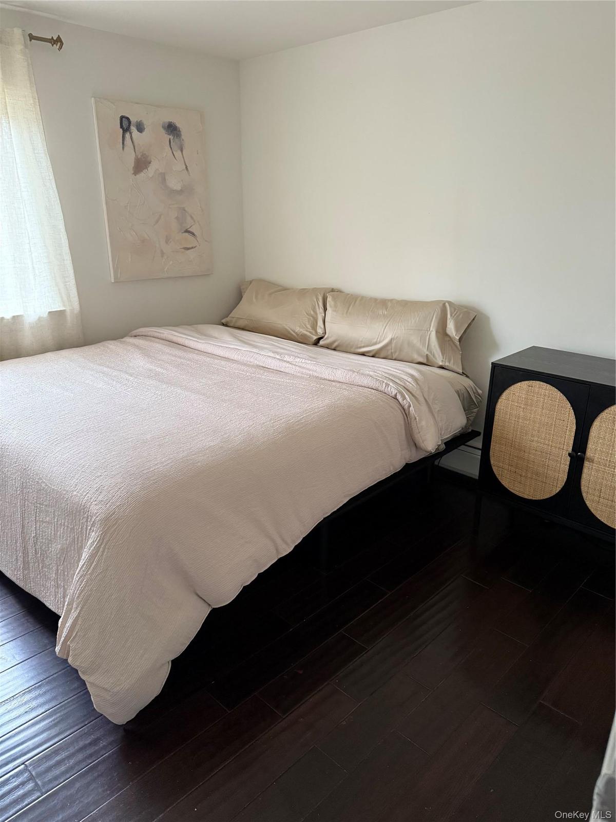 Bedroom with wood-type flooring