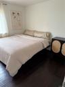 Bedroom with wood-type flooring