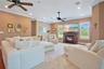 Family Room with Recessed Lighting and Plush Carpet