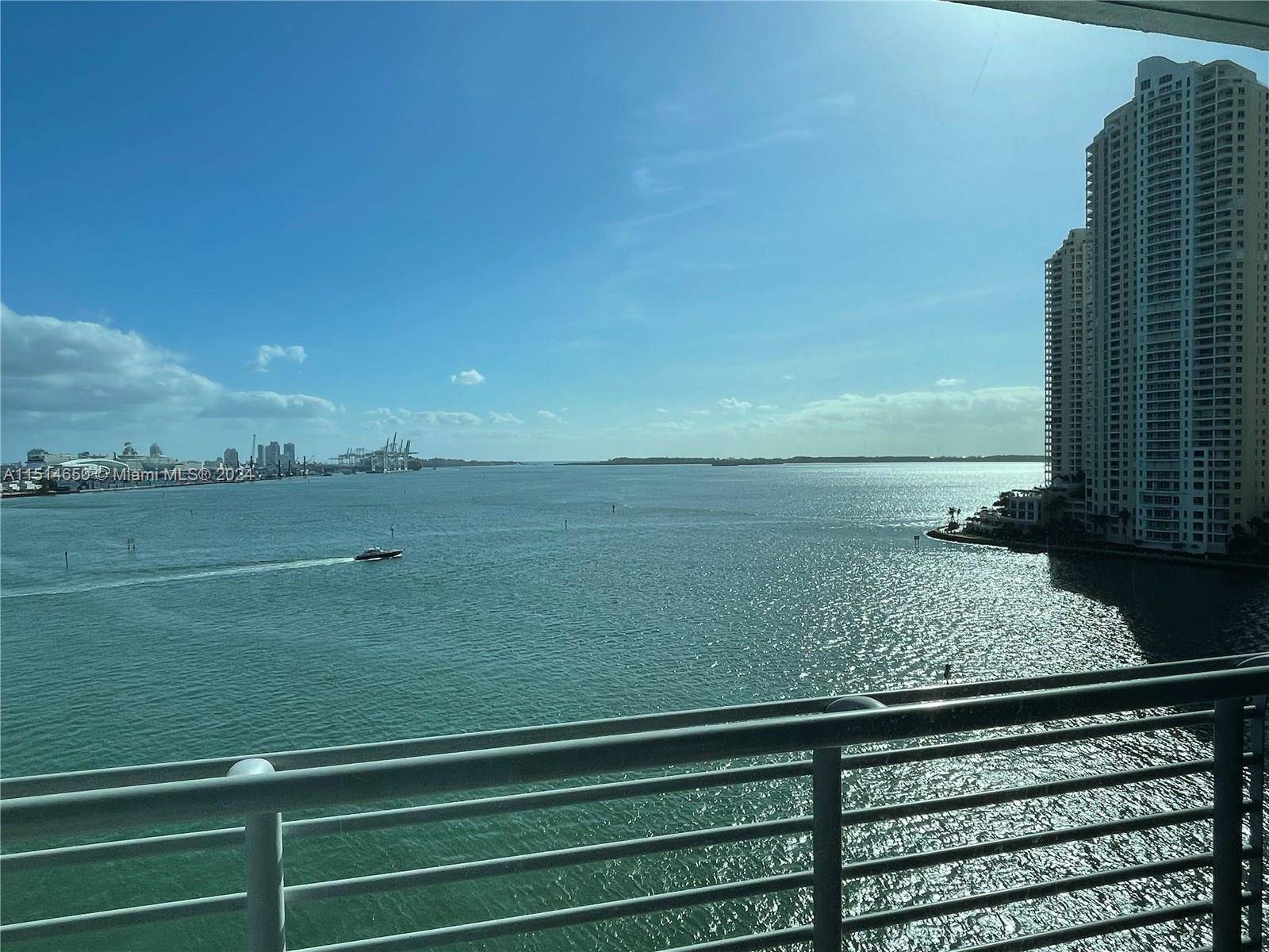 Spectacular direct views of beautiful Biscayne Bay, the Miami River, Port of Miami Bayfront Park.