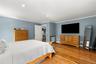Bedroom featuring ornamental molding, light wood-style flooring, and recessed lighting