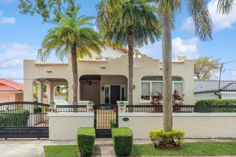 A captivating, two story Old Spanish residence nestled in The Roads neighborhood graces the outskirts of the vibrant City of Brickell, Miami.