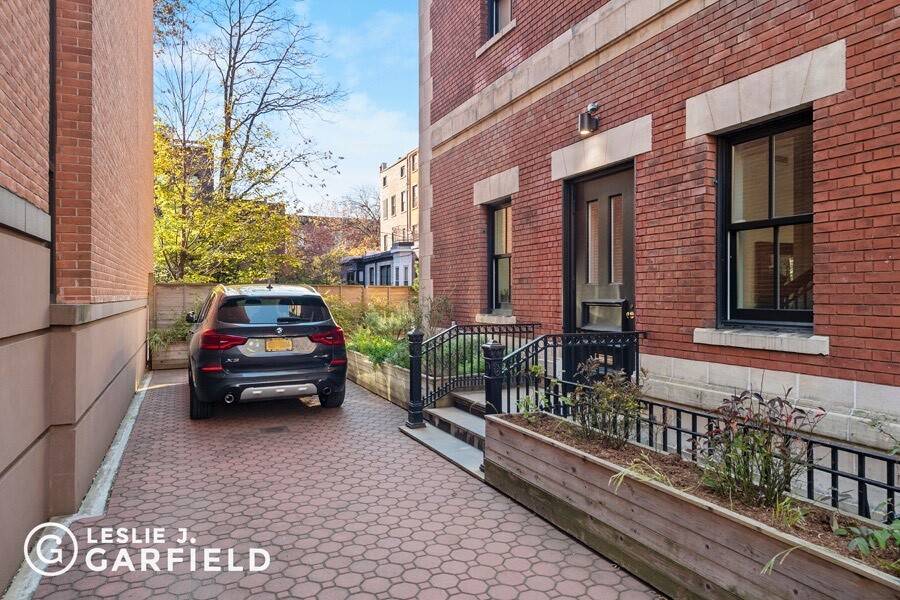 30' wide, mint condition, in the heart of Cobble Hill, with 2 car private parking, and 2 private outdoor spaces.
