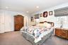 Bedroom with dark carpet