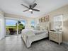 The large primary bedroom has it's own private lanai