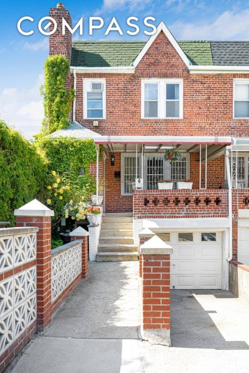 Charming brick Kensington row house with private parking for two cars a garage and a driveway !