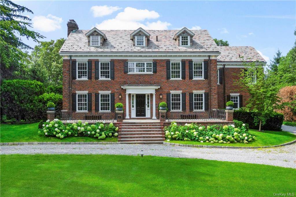 Stunning updated Scarsdale brick Colonial complete with in ground pool, tennis court, spa sauna on over 1 acre of level park like grounds is ready for you.