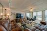 The living area features full-length windows with unobstructed ocean views and access to the balcony an ideal setting for relaxing or hosting guests.