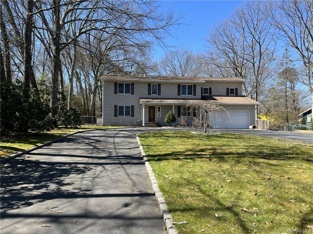 Exquisitely nestled in the serene enclave of Smithtown Pines, this meticulously renovated 3200 sq ft colonial offers an impeccable blend of elegance and comfort.