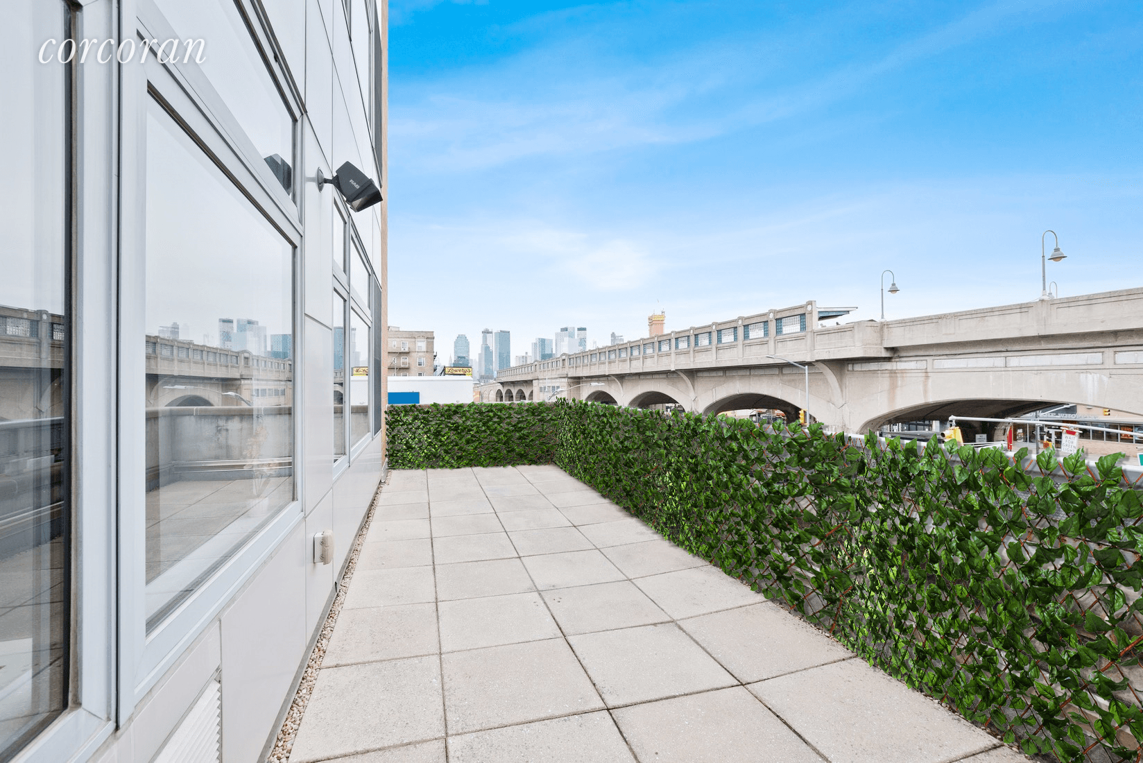 GUT RENOVATED two bedroom, one bathroom with spacious terrace and city views in the heart of Sunnyside !