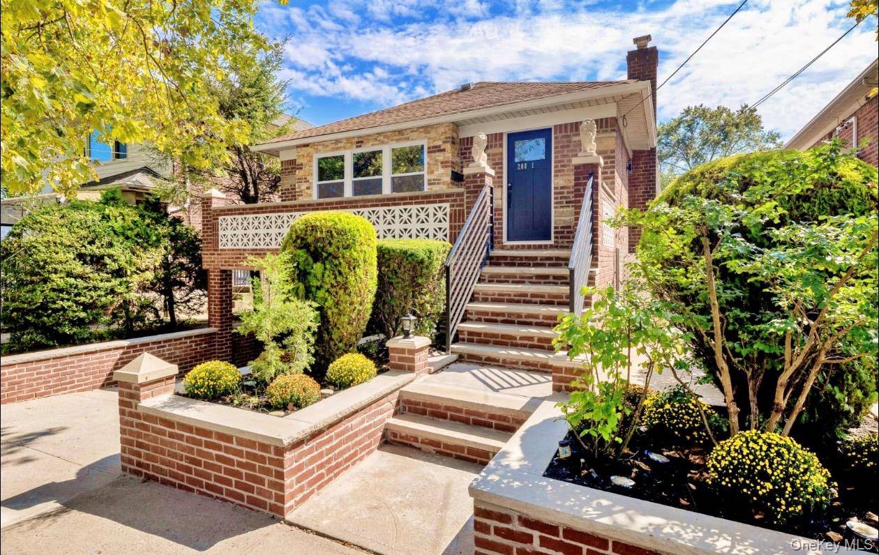 All brick, detached two family in prime Bayside Oakland Gardens location.
