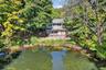 Rear view of property featuring a water view and a patio